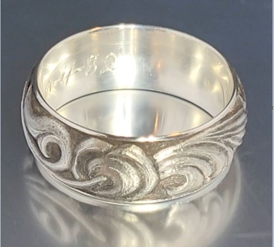 Featured engraving work — silver metalwork detail